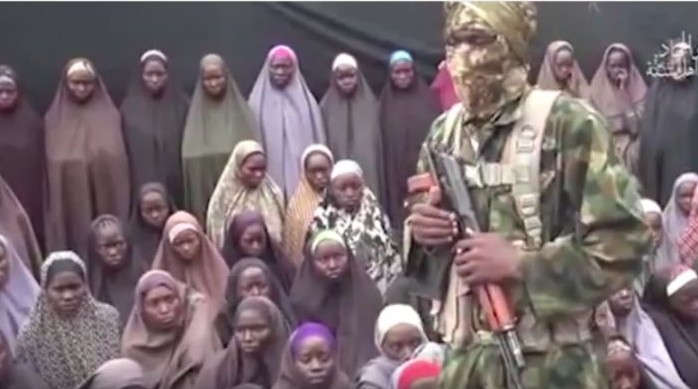 An image taken from a video released on August 14, 2014 by the Nigerian jihadist group Boko Haram purportedly shows dozens of girls kidnapped by the group in 2014. (screen capture: YouTube)