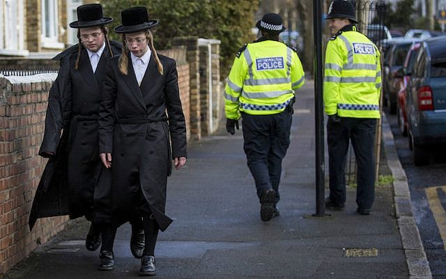 Illustrative: ultra-Orthodox men walking along the street in the Stamford Hill area of London, Jan. 17, 2015. (Rob Stothard/Getty Images via JTA)