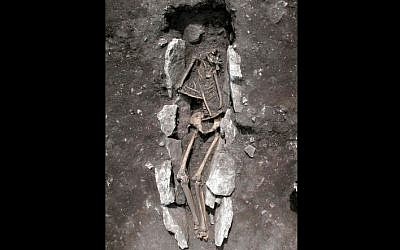 This undated photo released Aug. 10, 2016, provided by the Greek Culture Ministry, shows the 11th century BCE skeleton of a teenager excavated recently at Mount Lykaion in the southern Peloponnese region of Greece, the mountaintop sanctuary of Zeus, king of the ancient Greek gods. (Greek Culture Ministry via AP)