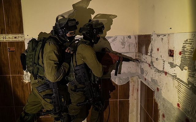 IDF soldiers prepare to raze the home of Mohammed Omaireh, who confessed to being part of a terrorist cell which shot dead an Israeli rabbi. The building was destroyed in the West Bank village of Dura, August 30, 2016. (IDF Spokesperson)