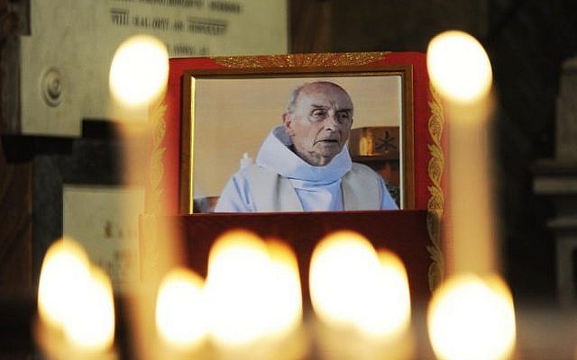 This file photo taken on August 17, 2016 shows a picture of slain Father Jacques Hamel displayed inside the church of San Luigi dei Francesi in downtown Rome. (AFP PHOTO / MARCO ZEPPETELLA