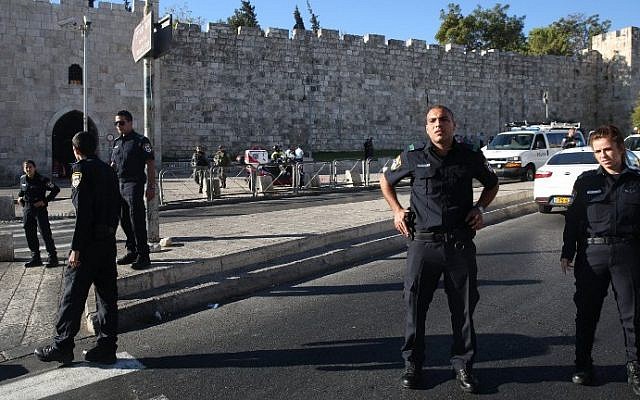 Israeli police stand guard on Sultan Suleiman Street near the Herod's Gate entrance to the Old City of Jerusalem, where an East Jerusalem man stabbed and wounded two Israeli police officers on September 19, 2016. (AFP/Menahem Kahana)
