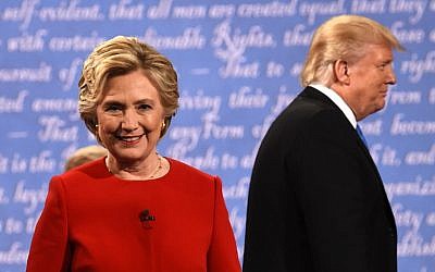 Democratic nominee Hillary Clinton and Republican nominee Donald Trump leave the stage after the first presidential debate at Hofstra University in Hempstead, New York on September 26, 2016. AFP PHOTO / Timothy A. CLARY)