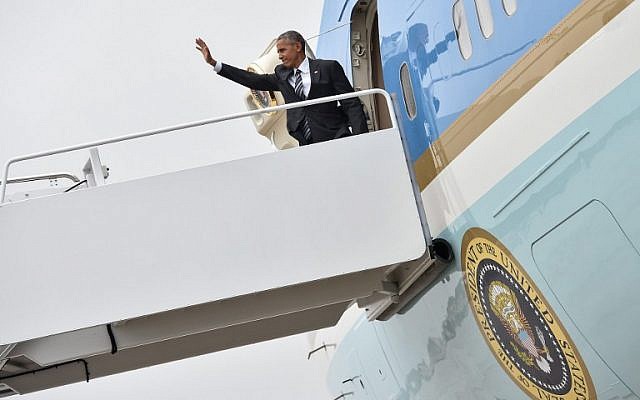 US President Barack Obama boards Air Force One at Andrews Air Force Base in Maryland on September 29, 2016 as he departs for Israel to attend the funeral of former Israeli president Shimon Peres in Jerusalem. (AFP Photo/Nicholas Kamm)