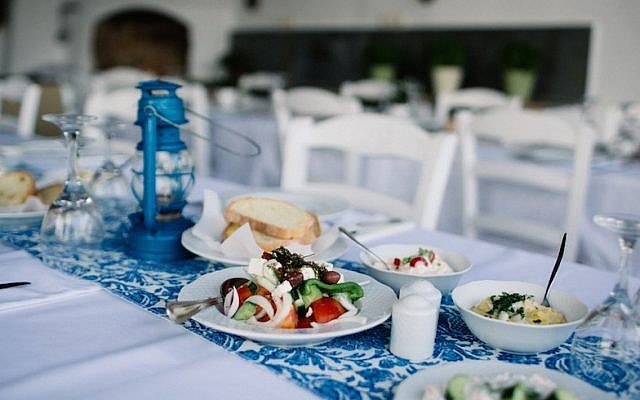 A spread of Greek food at an Israeli wedding in Tinos, Greece, June 23, 2016. (We Are Red/JTA)