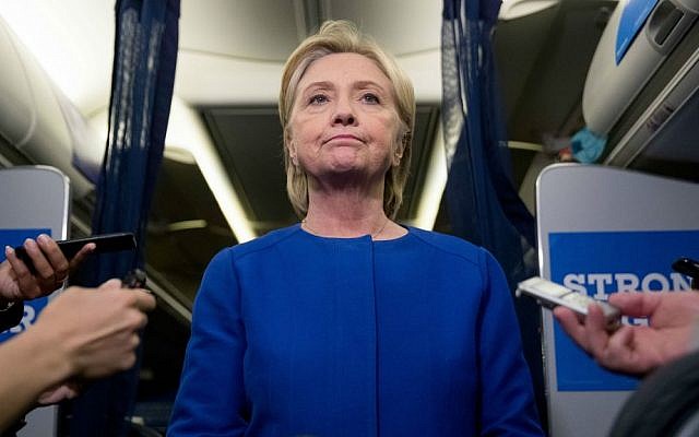Democratic presidential candidate Hillary Clinton delivering remarks on the explosion in Manhattan's Chelsea neighborhood aboard her campaign plane at Westchester County Airport, in White Plains, New York, Saturday, Sept. 17, 2016. (AP Photo/Andrew Harnik)