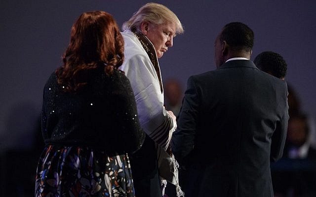Republican US presidential candidate Donald Trump wears a prayer shawl during a church service at Great Faith Ministries on September 3, 2016, in Detroit. (Evan Vucci/AP Photo)