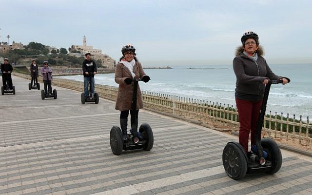 File: Tourists ride Segways down the Tel Aviv promenade on February 21, 2012. (Moshe Shai/Flash90)