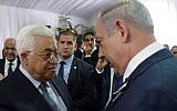 Prime Minister Benjamin Netanyahu meets with Palestinian president Mahmoud Abbas during the state funeral of late president Shimon Peres, held at Mt. Herzl in Jerusalem on September 30, 2016. (Amos Ben Gershom/GPO)