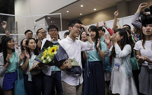 Political party Demosisto's Nathan Law, who helped lead the 2014 protests, celebrates with his supporters after winning a seat at the legislative council elections in Hong Kong, September 5, 2016. (AP Photo/Kin Cheung)