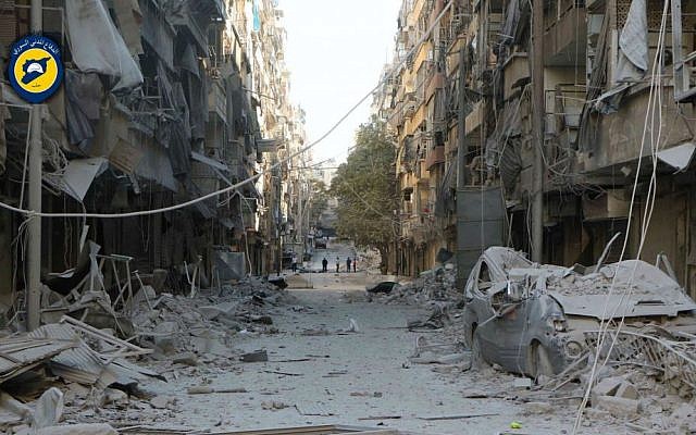 In this photo provided by the Syrian Civil Defense group known as the White Helmets, shows heavily damaged buildings after airstrikes hit in Aleppo, Syria, Saturday, Sept. 24, 2016. (Syrian Civil Defense White Helmets via AP)