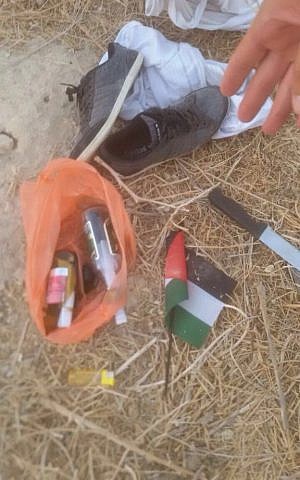 Firebombs, a knife and flag found on a Palestinian boy suspected of planning an attack in the West Bank on September 18, 2016. (Police)