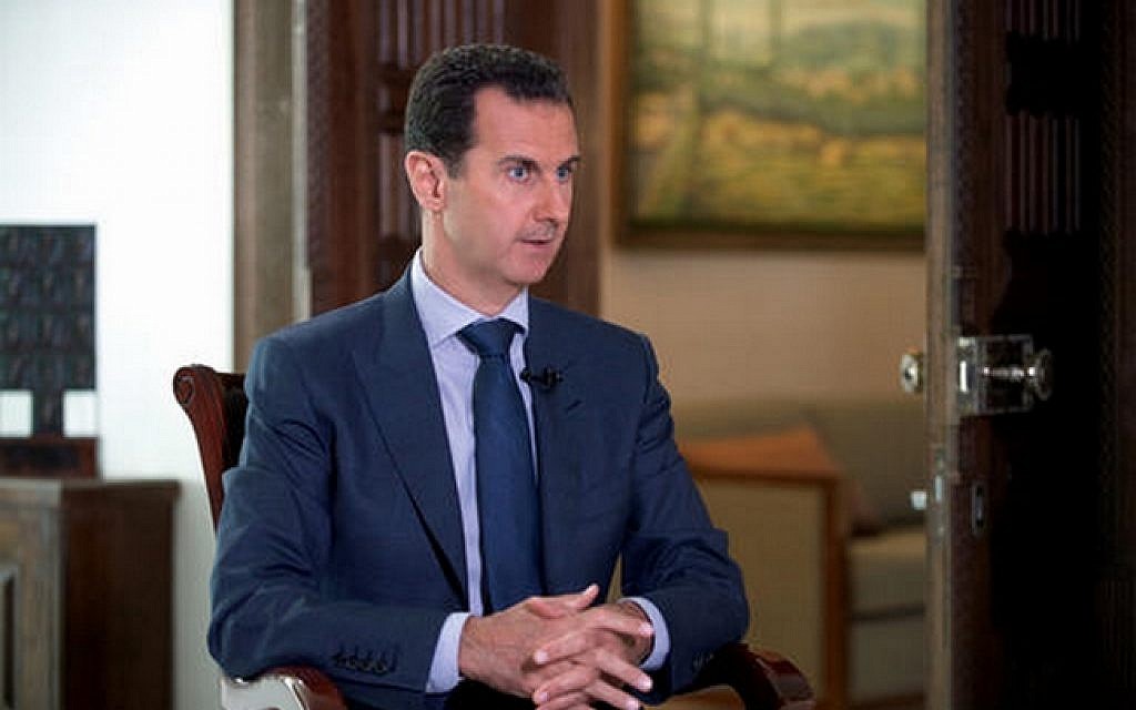Syrian President Bashar Assad speaks to The Associated Press at the presidential palace in Damascus, Syria in a photo released by the Syrian presidency on Wednesday, Sept. 21, 2016. (Syrian Presidency via AP)