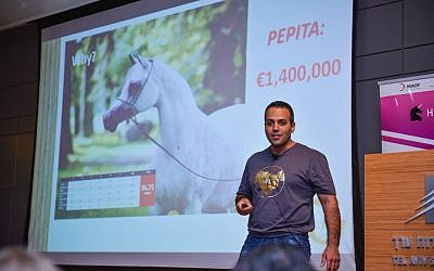 An entrepreneur from Horse Mate presents on his start-up project at the Hybid demo day in Tel Aviv on September, 22, 2016 (Courtesy)