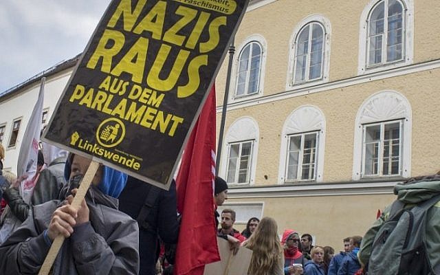 This file photo taken on April 18, 2015 shows protesters gathering outside the house where Adolf Hitler was born during the anti-Nazi protest in Braunau Am Inn, Austria. (AFP PHOTO / JOE KLAMAR)