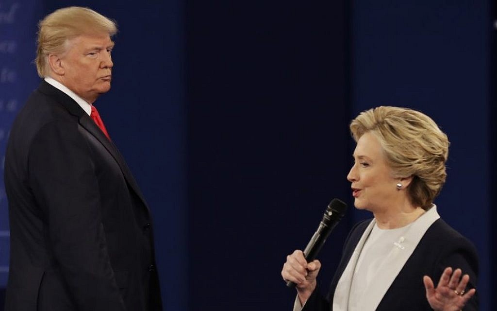 Republican presidential nominee Donald Trump, left, listens to Democratic presidential nominee Hillary Clinton during the second presidential debate at Washington University in St. Louis, October 9, 2016. (AP/Patrick Semansky)