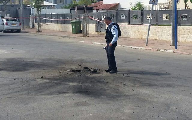 A rocket launched from the Gaza Strip strikes a road in the southern city of Sderot on October 5, 2016. (Boaz Tzabari)
