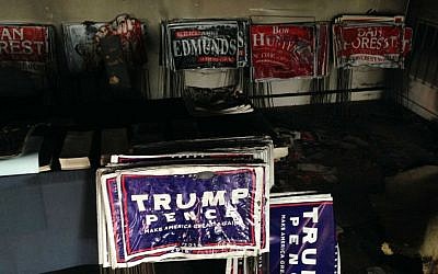Melted campaign signs are seen at the Orange County Republican Headquarters in Hillsborough, North Carolina on Sunday, Oct. 16, 2016. (AP Photo/Jonathan Drew)