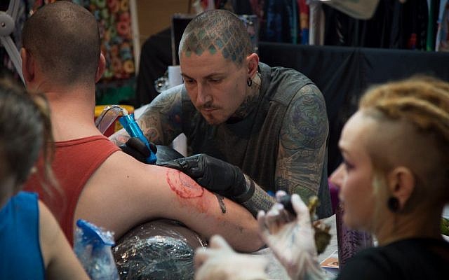 Around 50 Israeli tattoo artists and 50 visiting studios offered discounted tattoos at the Israel Tattoo Convention in Tel Aviv. October 7, 2016. (Luke Tress/Times of Israel)