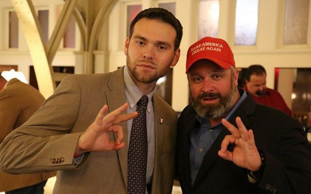 Alt-right radio personality Joe Biggs (right) poses with Jack Posobiec for a photograph in the atrium of Trump International Hotel in Washington, DC. (Eric Cortellessa/The Times of Israel)