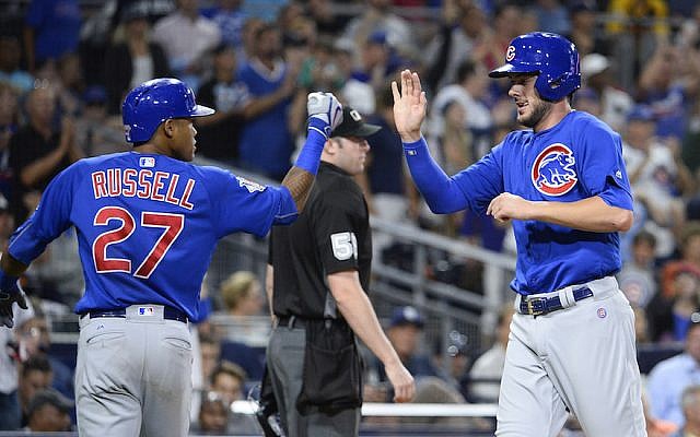 Addison Russell, left, with Cubs teammate Kris Bryant during the fifth inning of a game against the Padres at Petco Park in San Diego, Aug. 23, 2016. (Denis Poroy/Getty Images via JTA)