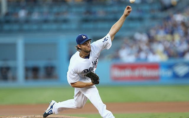 Clayton Kershaw of the Los Angeles Dodgers pitching against the Colorado Rockies at Dodger Stadium, Sept. 24, 2016. (Stephen Dunn/Getty Images via JTA)