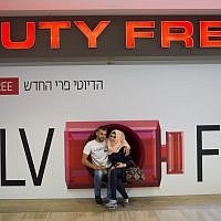 A Muslim couple poses for a picture at the Duty Free at Ben Gurion International Airport in Tel Aviv, Israel on April 30, 2016. (Nati Shohat/Flash90)