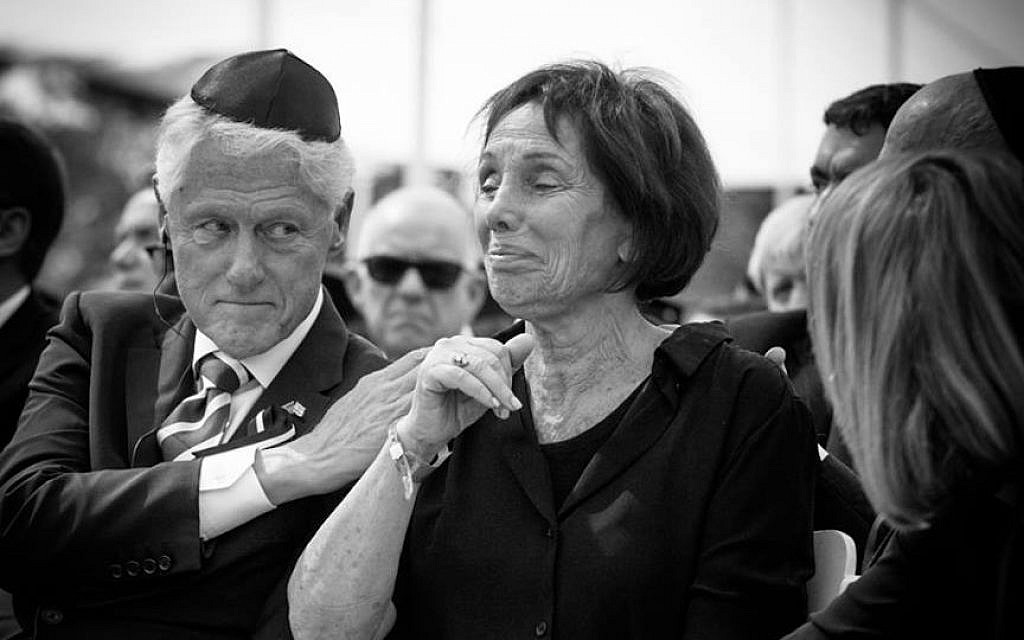 Bill Clinton comforts Shimon Peres's daughter Tzvia (Elad Malka)