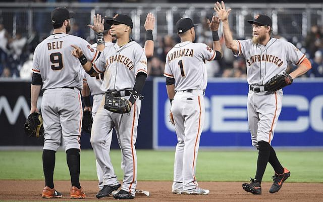 San Francisco Giants players, including Hunter Pence, right, celebrating a win against the Padres at Petco Park in San Diego, Sept. 22, 2016. (Denis Poroy/Getty Images via JTA)