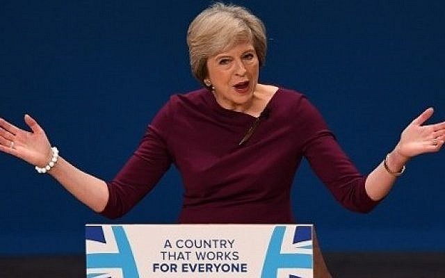 British Prime Minister Theresa May gestures as she delivers a keynote address on the final day of the annual Conservative Party conference in Birmingham, central England, on October 5, 2016.  (AFP PHOTO / PAUL ELLIS)