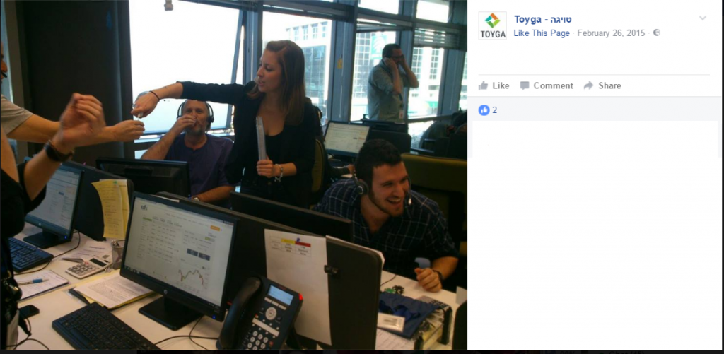 Inside Toyga: A screenshot from Toyga's Facebook page shows call center employees at computers with the brand UFX displayed (Screenshot).