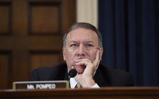 Republican Representative Mike Pompeo of Kansas listens as former US secretary of state Hillary Clinton testifies before the House Select Committee on Benghazi on Capitol Hill in Washington, DC on on October 22, 2015. (AFP PHOTO/SAUL LOEB)