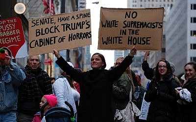 A woman protests against US President-elect Donald Trump in front of Trump Tower on November 20, 2016 in New York. (AFP/Kena Betancur)