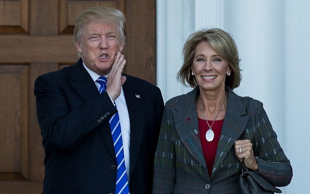 President-elect Donald Trump and Betsy DeVos after their November 18, 2016 meeting at Trump International Golf Club, in Bedminster Township, New Jersey.  (AFP PHOTO / GETTY IMAGES NORTH AMERICA / Drew Angerer)
