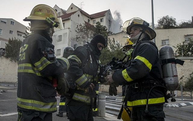 Palestinian firefighters from the West Bank city of Jenin arrive to help extinguish a fire in the northern Israeli city of Haifa following a wildfire, on November 25, 2016. (AFP/Jack Guez)