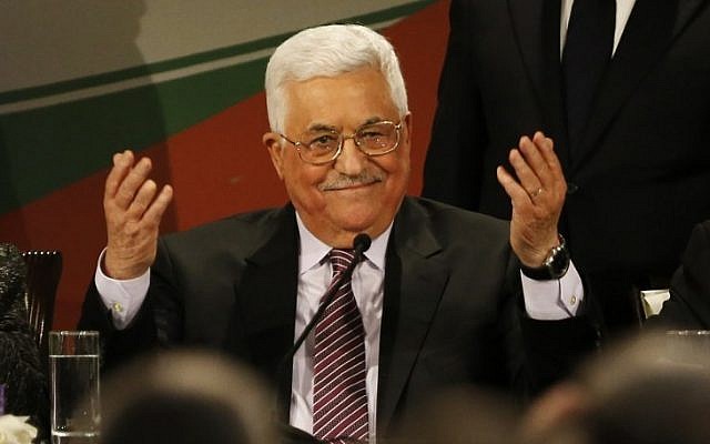 Palestinian Authority President Mahmoud Abbas gestures after delivering a speech on the second day of the 7th Fatah Congress in the West Bank city of Ramallah on November 30, 2016. (AFP/Abbas Momani)