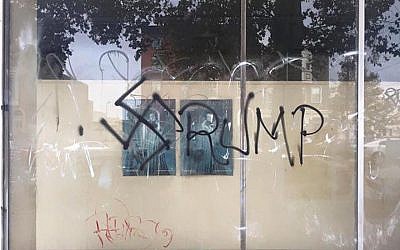 Graffiti in South Philadelphia, including the word “Trump” and a swastika discovered on a Philadelphia storefront on November 9, 2016. (Facebook via JTA)