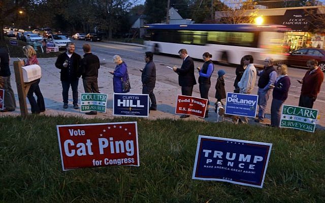 Last time: Voters line up on Election Day outside a fire station in Indianapolis, Indiana, Tuesday, Nov. 8, 2016. (AP Photo/Michael Conroy)