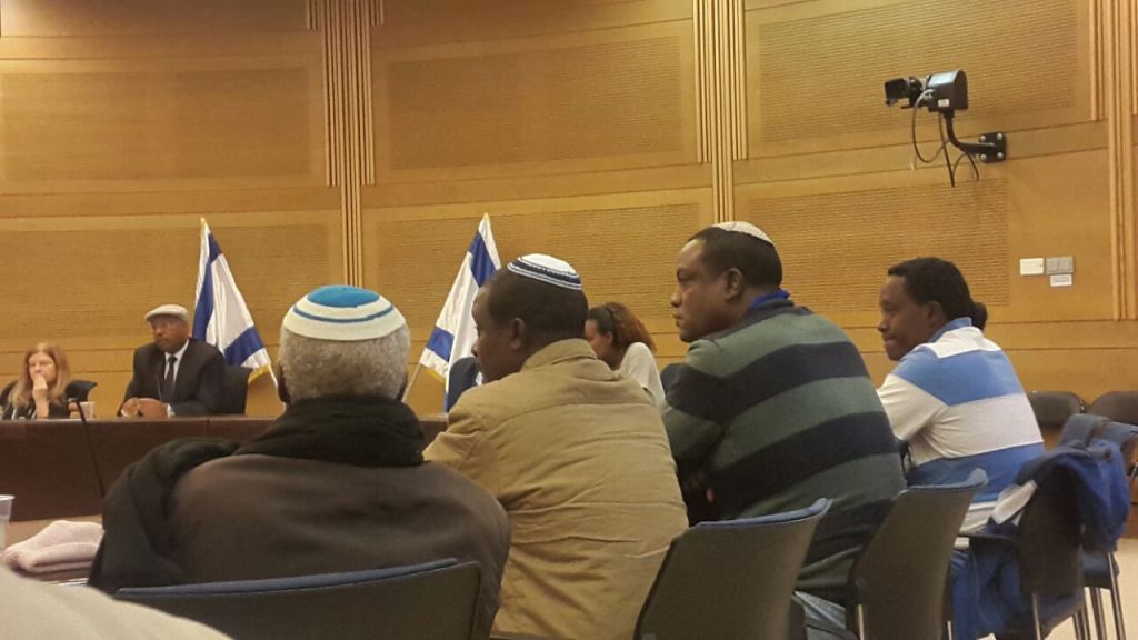 Ethiopian Israelis appeal to government to allow their relatives to immigrate in the Knesset on November 29, 2016. Yahallem Tadessa is pictured on the second right (Marissa Newman/Times of Israel)