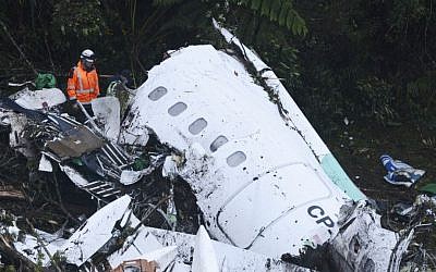Rescue workers search at the wreckage site of a chartered airplane that crashed outside Medellin, Colombia, on Tuesday November 29, 2016. (AP Photo/Luis Benavides)
