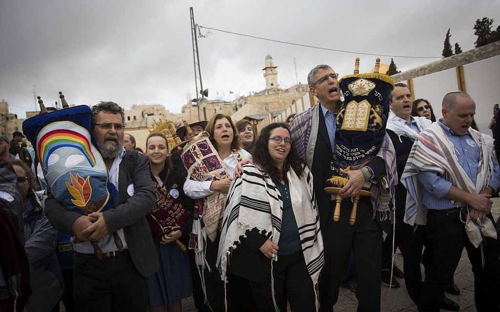 A group of American Conservative and Reform rabbis and members of the Women of the Wall carry Torah scrolls during a protest march against the government’s failure to deliver a new prayer space, at the Western Wall in Jerusalem's Old City, November 2, 2016. (Hadas Parush/Flash90)