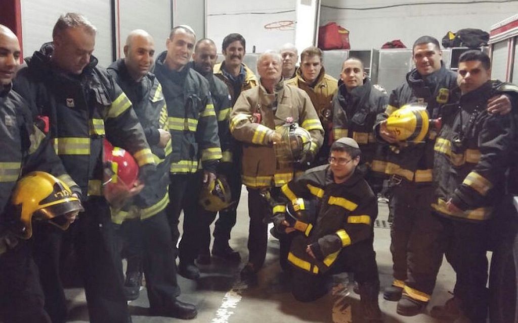 American and Israeli firefighters posing for photographs after returning from a call in Jerusalem, Nov. 27, 2016. (Courtesy of Emergency Volunteers Program)