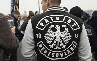 A demonstrator wears a jacket with the writing "Patriot Deutschland" (Germany Patriot) during the fourth demonstration of the right-wing populist alliance 'Wir fuer Deutschland' in Berlin, Germany, Saturday, November 5, 2016. (Paul Zinken/dpa via AP)
