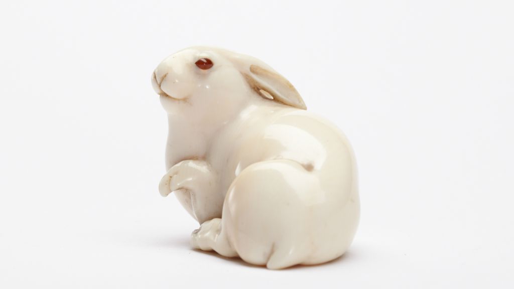 Ivory netsuke, the hare with amber eyes in the title of Edmund de Waal's family memoir. (Lostrobots CC BY-SA 4.0 via Wikimedia Commons)