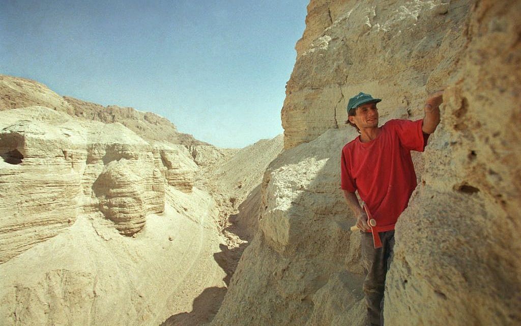Roi Porat, an Israeli student of archaeology, works near the remains of a cave found at the West Bank archeological site of Qumran, near the Dead Sea Thursday, July 26, 2001. An Israeli antiquities official said November 14, 2016, that Israel is embarking on a major expedition to find more Dead Sea Scrolls and other artifacts. (AP Photo/Lefteris Pitarakis, File)