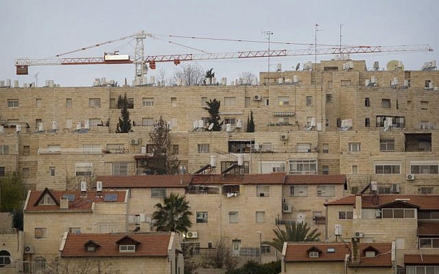 Construction cranes in the neighborhood of Gilo in East Jerusalem, January 16, 2011. (AP Photo/Sebastian Scheiner, file)