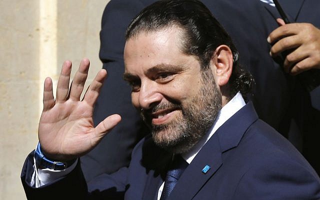 Lebanese Prime Minister Saad Hariri waves to journalists, shown before his election upon his arrival to the parliament building in Beirut, Lebanon, October 31, 2016. (AP Photo/Hussein Malla)