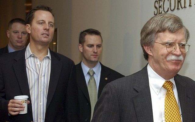 In this Nov. 11, 2006 file photo, Richard Grenell, left, walks with John Bolton, the United States ambassador to the United Nations, right, to a Security Council meeting at the United Nations headquarters in New York. (AP Photo/Osamu Honda)