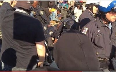 Police break up scuffles between protesters and alt-right activists outside the National Policy Institute conference in Washington DC, on November 19, 2016. (screen capture: YouTube) 