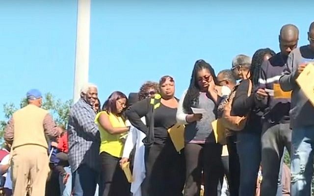 African-American voters cast early ballots in Raleigh, North Carolina as part of the 'Souls to the Polls' drive by black churches, in a still image taken from a CBS video aired on October 25, 2016 (screen capture: YouTube)
